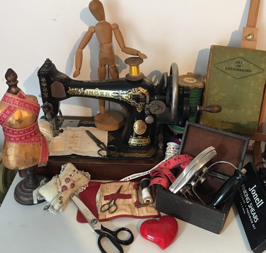 Sewing materials Various sewing equipment eg vintage sewing machine, small mannequin, sewing notebook, measuring tape, needles